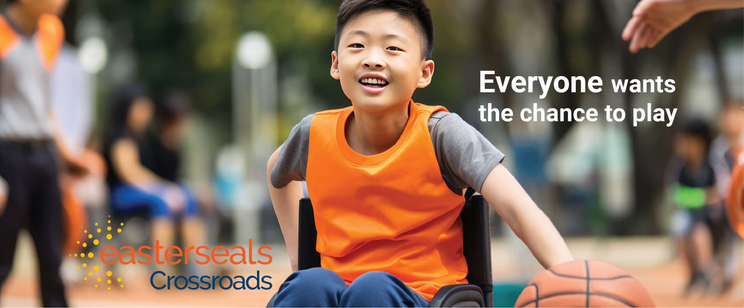 young boy playing wheelchair basketball